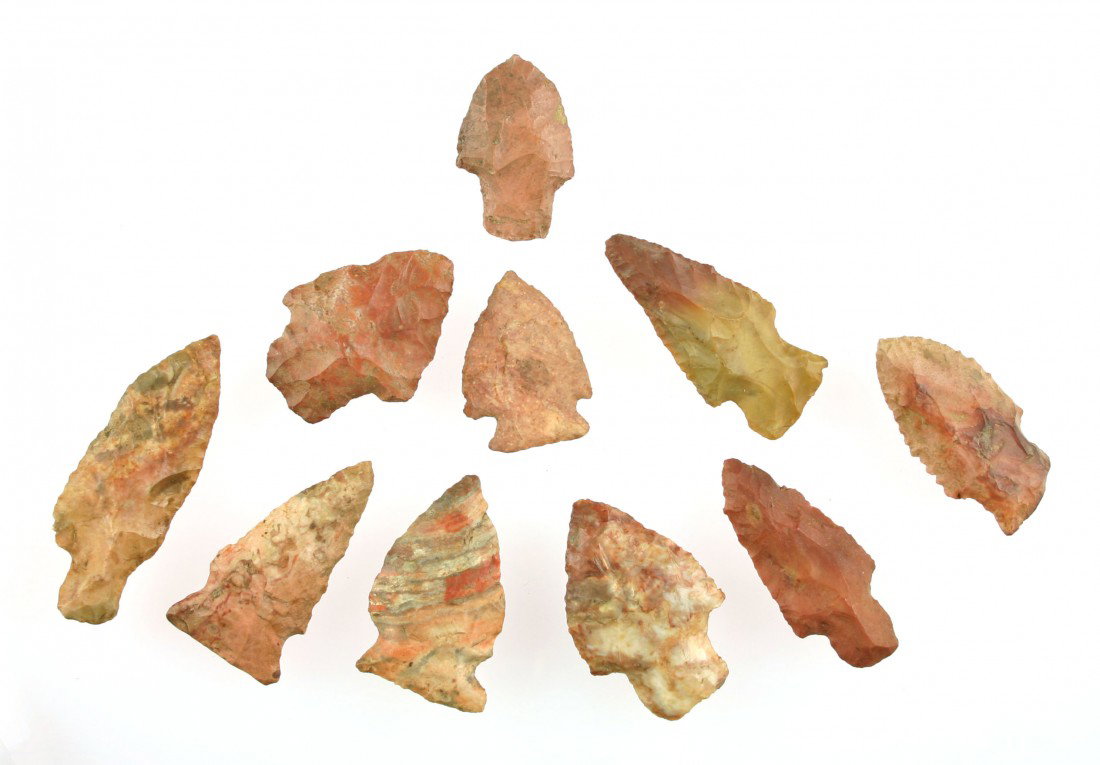 10 Piece Arrowhead Collection with Extreme Color: 10 pieces all with extreme color from Southwestern Tennessee. Biggest is 2 1/4 inches. Ex- Judge Walker Collection. Gorgeous displayed in a frame. Indians truly had a Picasso like eye for beauty and i