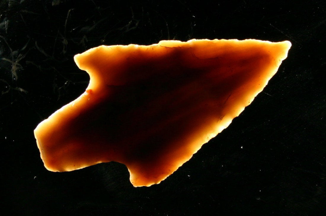 Outstanding 2 3/8" Adena: Made of beautiful caramel and red colored Carter Cave flint with great style. Needle tip. Square base. Really nice. Found in Bath Co., Kentucky. Ex- White Collection.