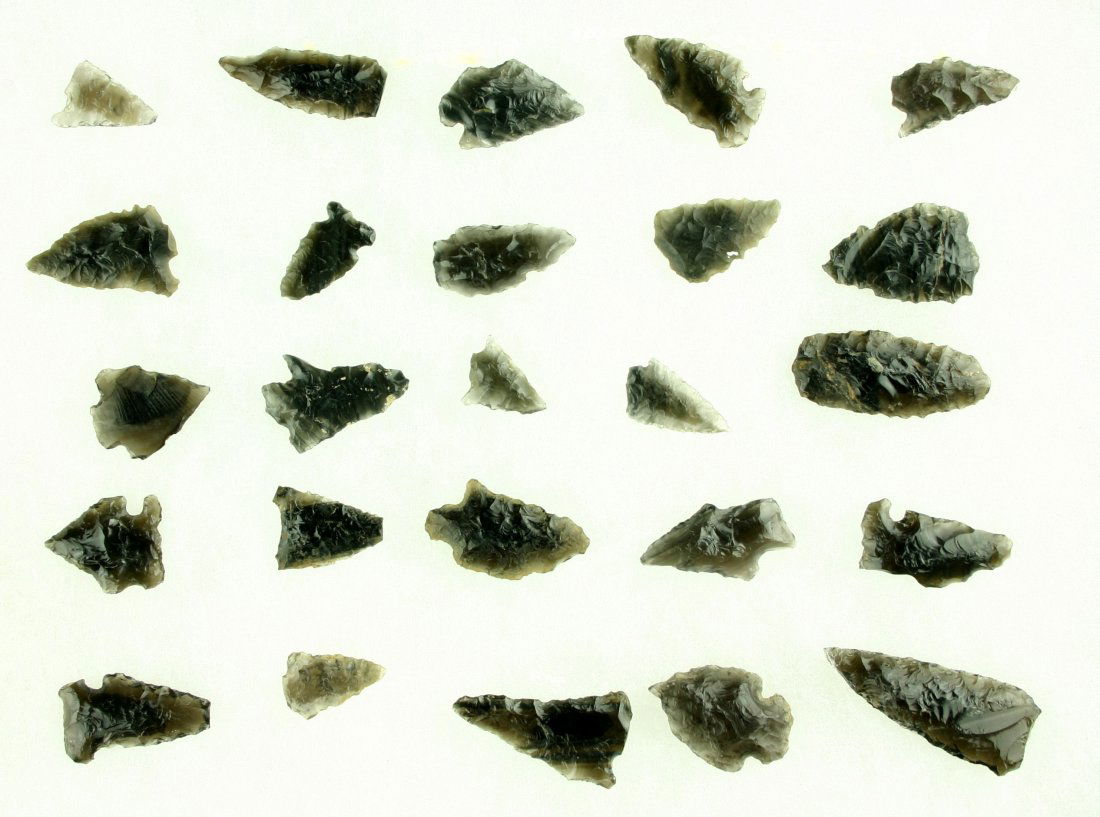 25 Translucent Obsidian Arrowheads: All from Southern Oregon. All nicely translucent. Biggest is 1 5/8". Ex- Butch Clark Collection.