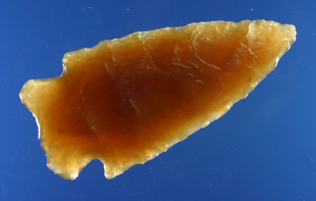 Superb 1 7/8" Translucent Knife River Besant: Great example. Well made and very pretty. Classic root beer colored Knife River Flint with great translucency. Ex- Lloyd Dugstad Collection, Who's Who Vol. 2, page 59.