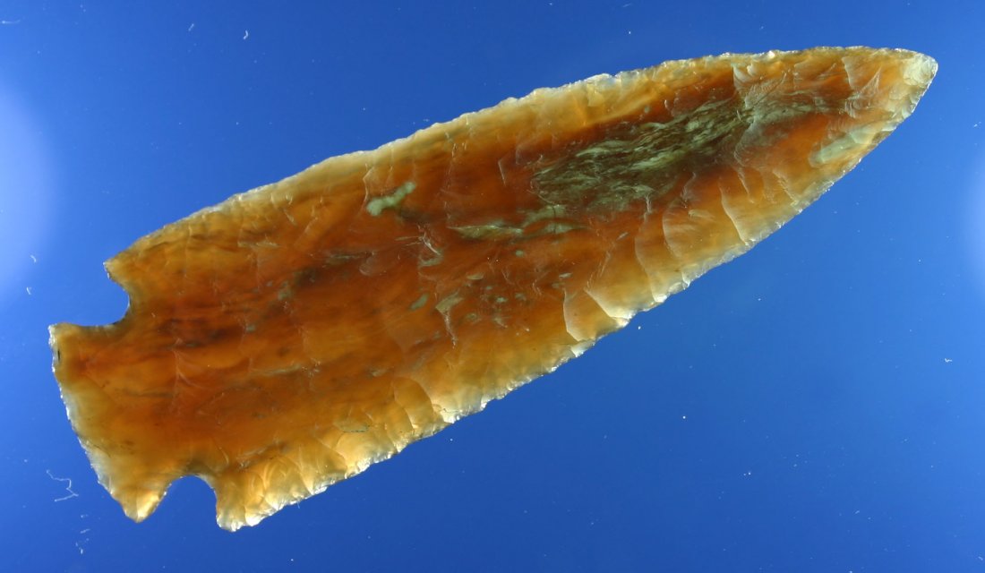 3 1/2" Knife River Pelican Lake- Jackson 'G-10' COA: Finest example we have ever seen. Made of gorgeous highly translucent root beer colored Knife River flint. Thin, flat, and fabulously flaked. Orinally collected by Lloyd Dugstad of Albert Lea, MN who 