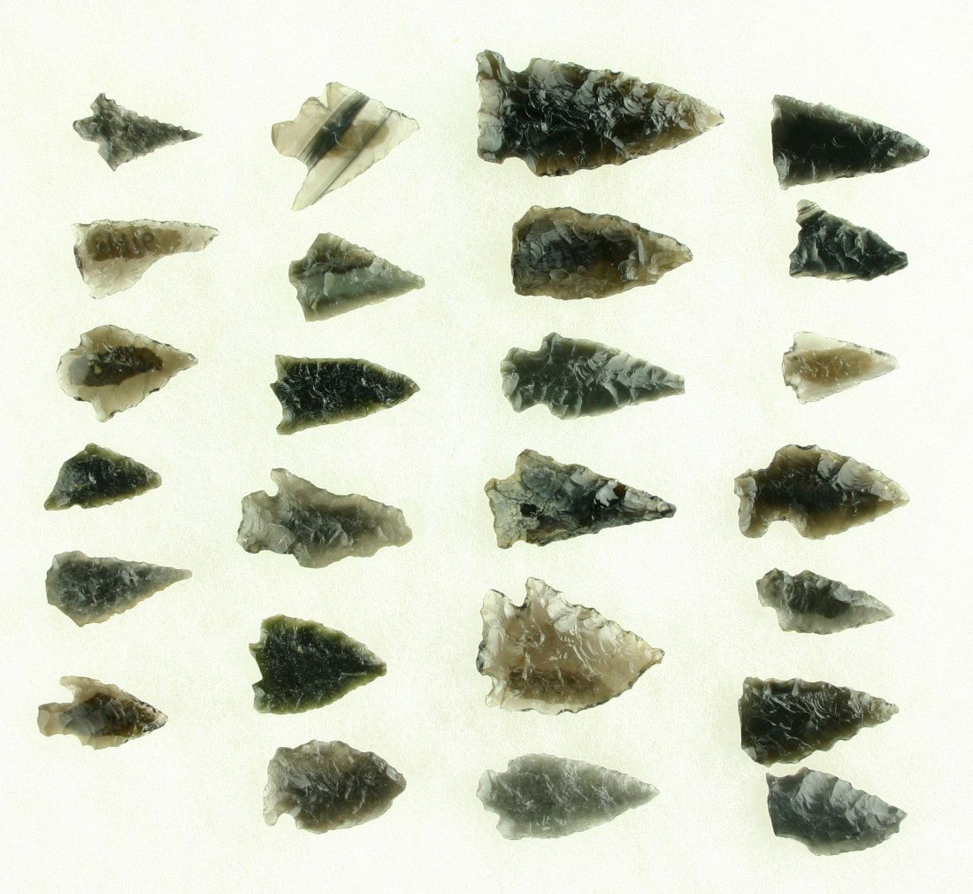 25 Translucent Obsidian Arrowheads: All from Southern Oregon. All nicely translucent. Biggest is 1 5/8". Ex- Butch Clark Collection.