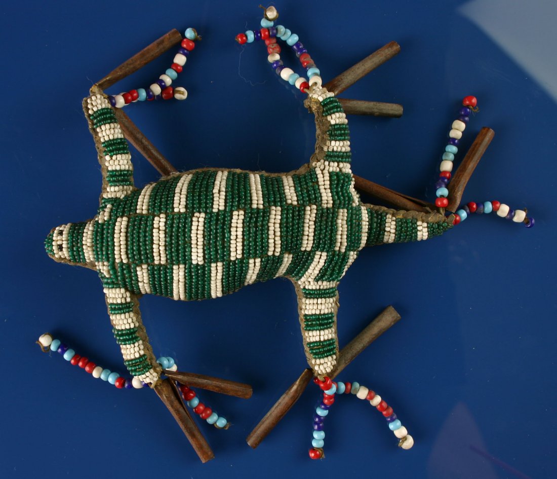 Excellent 7 1/2" Sioux Umbillical Fetish: Very detailed lizard or turtle. Even has beaded eyes. Great beadwork literally completely intact and stable including no the leather. All sinew sewn. Old collection. Late 1800's example.