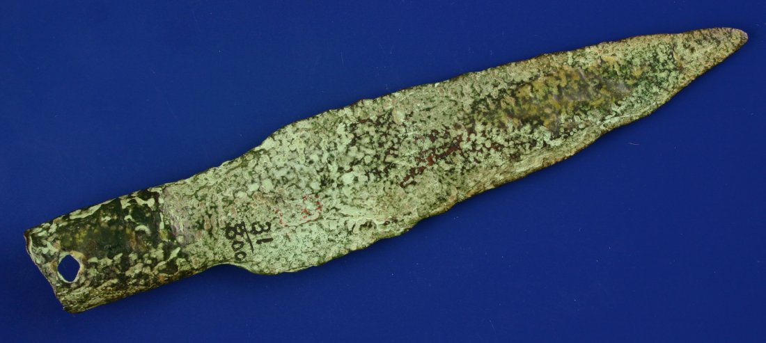 5 3/4" Socketed Copper Spear: Wonderful Old Copper Culture artifact made from hammered glacial drift copper. Found by the Schug Family in Jefferson Co., Wisconsin. Approx. 2,000-6,000 years old. Features hole in socket to facilita