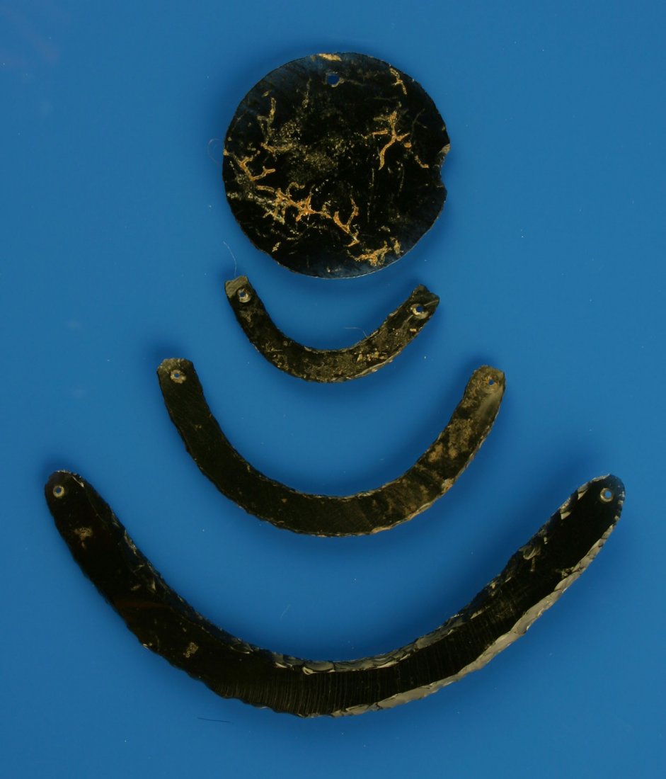Colima Necklace Ensemble: Three nice Crescent Gorgets with Obsidian Disc. Formerly of the Lucia-Meza Collection. Largest 4 5/16"