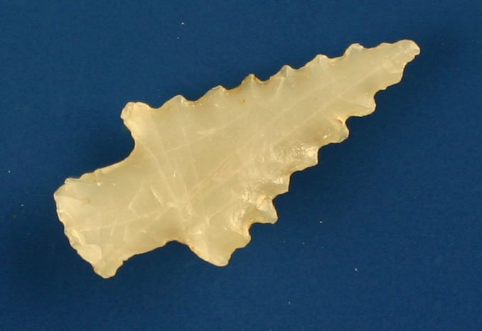 7/8" Bonham: Totally translucent Novaculite example found by Ruben Rankin in Saline Co., Arkansas. Serrated! Pictured in Overstreet #11 pg 563.
