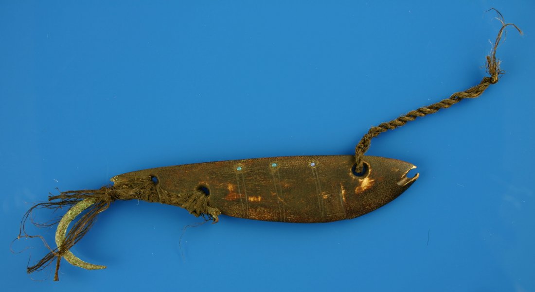 5 11/16" Bone Lure: Eskimo or Northwest Coast carved lure with copper hook and seed bead inlay. Woven textile lashing and leader present ?possibly made from baleen? Engraved features also present. Circa 1880-1930