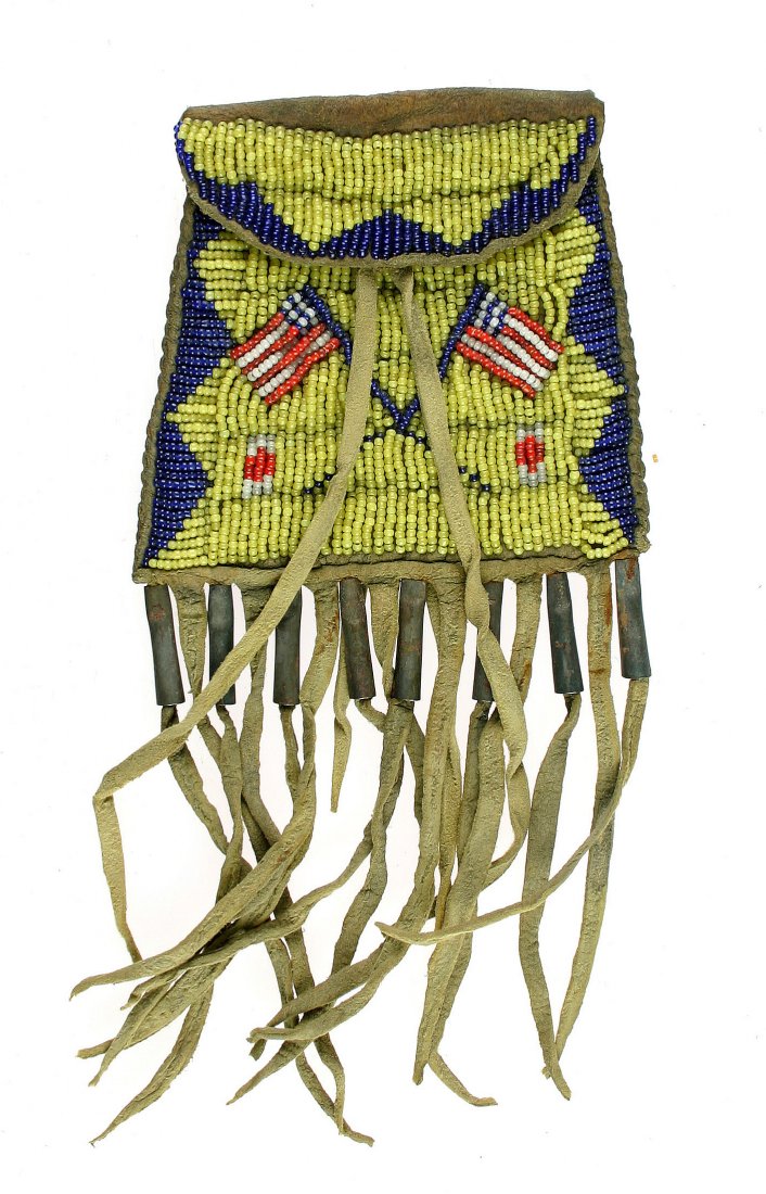 Plains Native American Indian Strike-A-Lite Bag: Super example with detailed U.S. Flags in the red, white, blue, and yellow beadwork. 9 inches overall including fringe. Leather and beadwork are in super very stable condition with no missing beads an