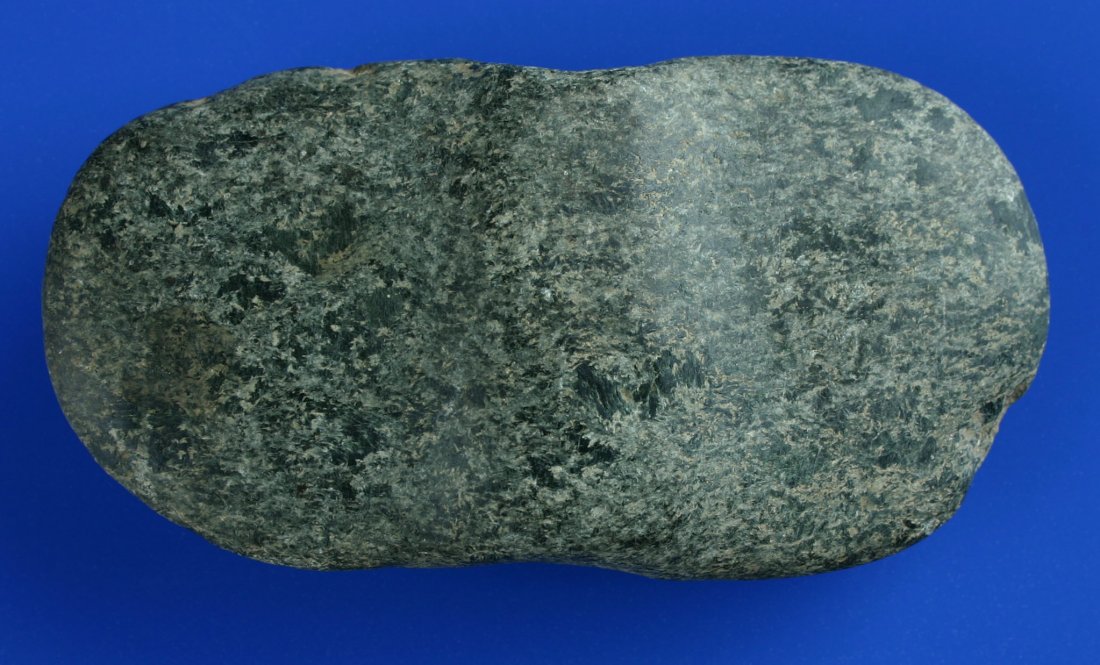 4 1/2" x 2 1/4" Undrilled Bannerstone: Great granite example from Fulton Co., Illinois. Ex- Comper Family Collection and found prior to 1989. Cane drilling with post started on one end.