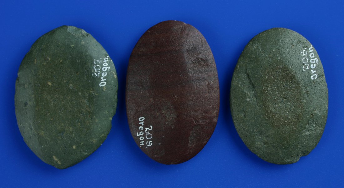 3 Polished Stone Ovals: All found in Oregon. Old collector numbers in white script. Biggest is 2 3/4". Thin, shaped into ovals, and highly polished. Red, gray, and green hardstone. Game pieces? Pendant preforms? Pottery smoo