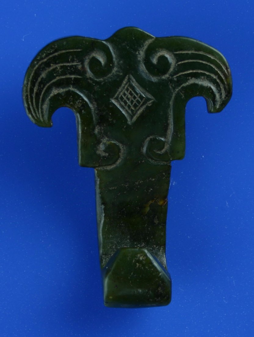 2 3/8" Chinese Nephrite Belt Hook: Rich spinach green material with great translucency. Early piece all hand carved in great condition with classic 'Monster face'.
