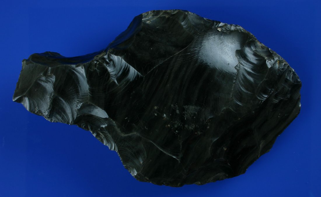 9" PreColumbian Obsidian Hand Ax: Obsidian piece with a great deal of residual Ochre/Cinnabar. Ex - Frederick Collection.