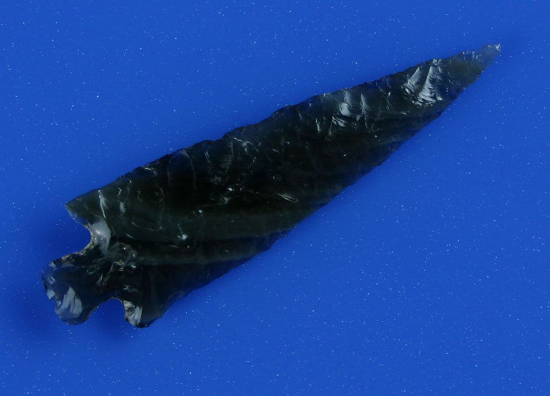 1 3/4" Rose Springs - Jackson 'G-9' COA: Wafer thin translucent banded Obsidian with super flaking. Needle tipped to boot. Really a great artifact. Amazing it survived undamaged. Found in lake Co., Oregon. Ex- Kirkpatrick Collection. Jackson