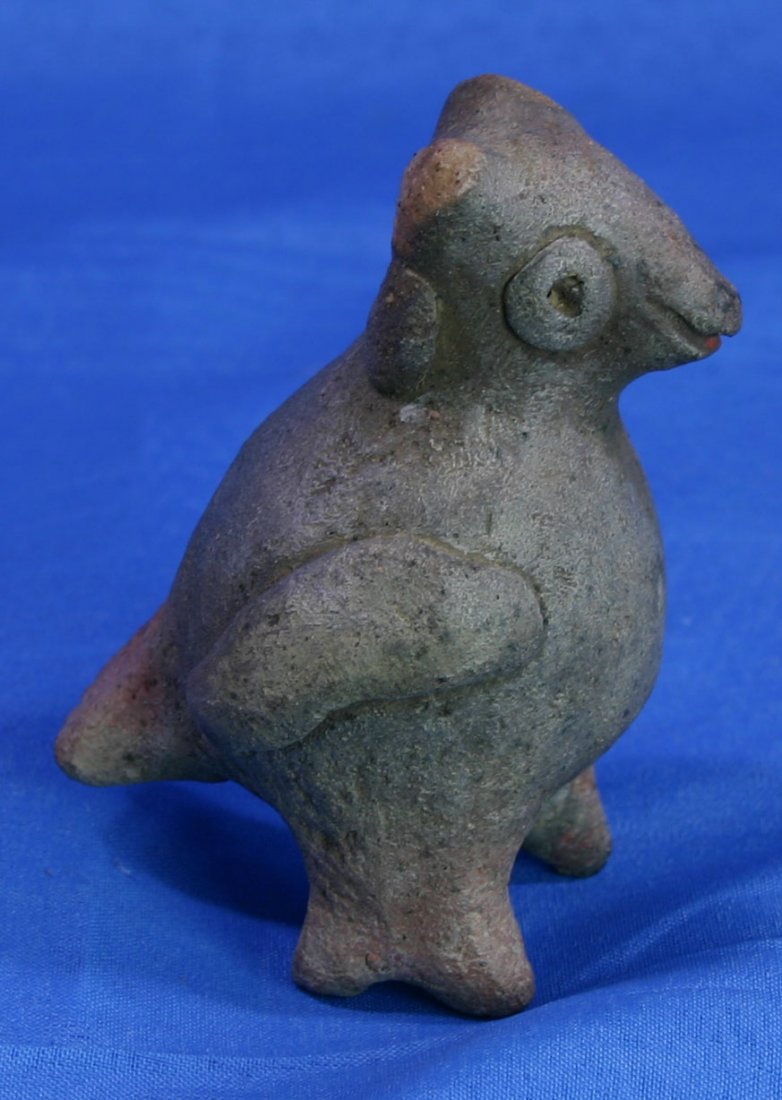 3 5/8" x 2 7/8" Bird Form Ocarina: Grandfathered Pre-Columbian example in fired clay. Eyes, wings, feet, tail, all there. Works beautifully with crisp vibrant whistle. Stands upright for great display. Circa 500 A.D. or so.