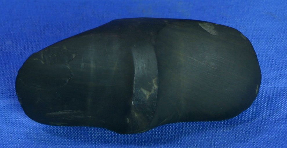 1 1/2"x3 1/8" Undrilled Winged Bannerstone: Slate example formerly of the Dr. Walker Collection. One repaired chip to one edge. Undrilled with slight torque to each 'wing'.