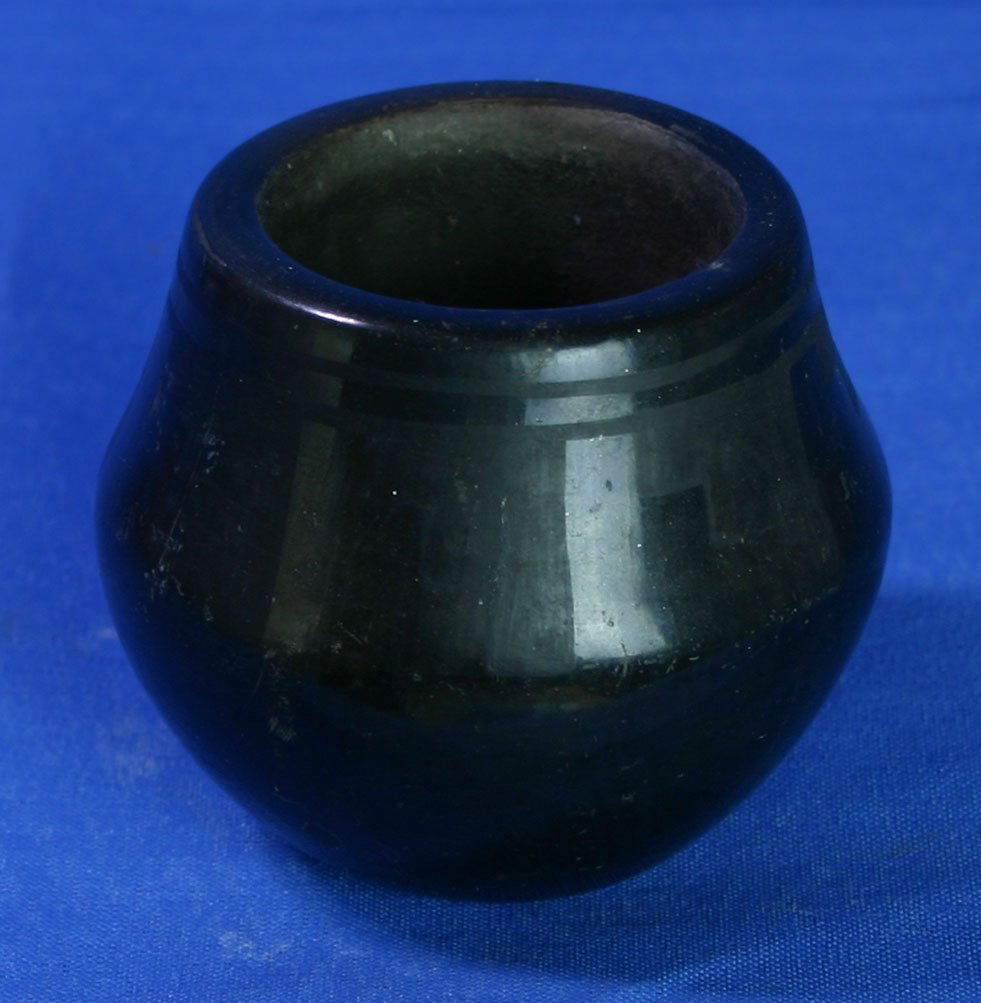 2 5/16"x2 5/8" Blackware Seed Jar - Blue Corn: Excellent blackware from the San Ildefonso Pueblo signed 'Blue Corn' (1921-1999). Highly desirable artist. Other examples have brought as much at $4,800. at auction. In 2008 this artist posthumously w