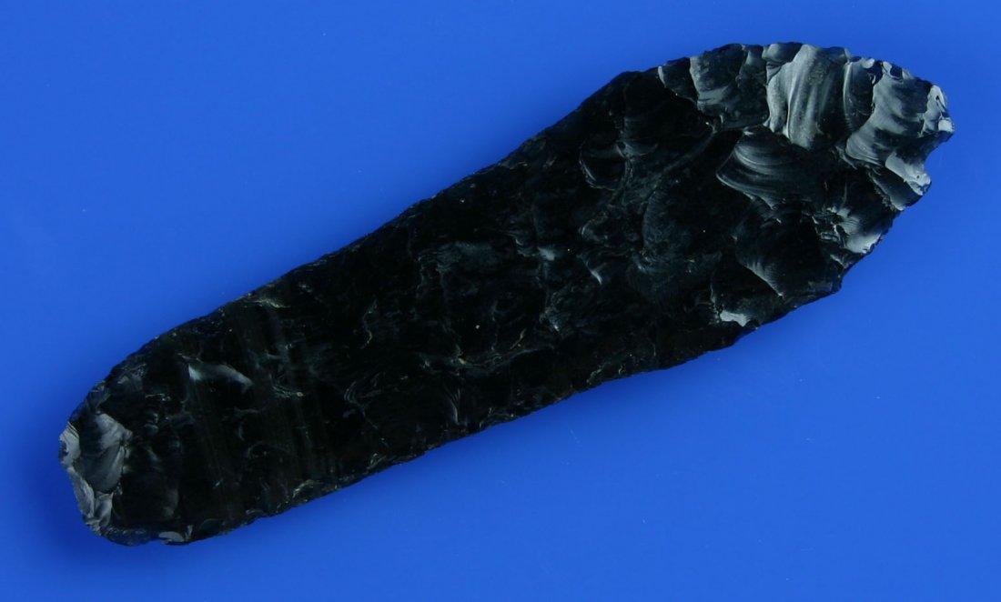3 3/16" Cougar Mountain - Davis/Stermer COAs: Textbook thin and excellent example in banded translucent Obsidian from Lake Co., Oregon. Great flaking. Long heavily ground stem. Davis and Stermer COA's.