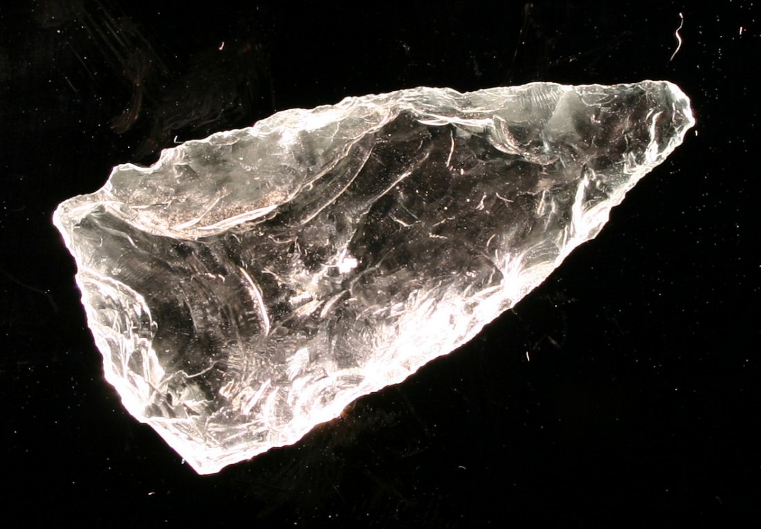 Extremely Rare 'Historic Era' 2" Glass Arrowhead: Found in New Mexico. Made from an old insulator or bottle. Has distinct desert smoothing/polish. Rare piece. Orignally collected by Gene Snyder. From the private collection of Bill Jackson.