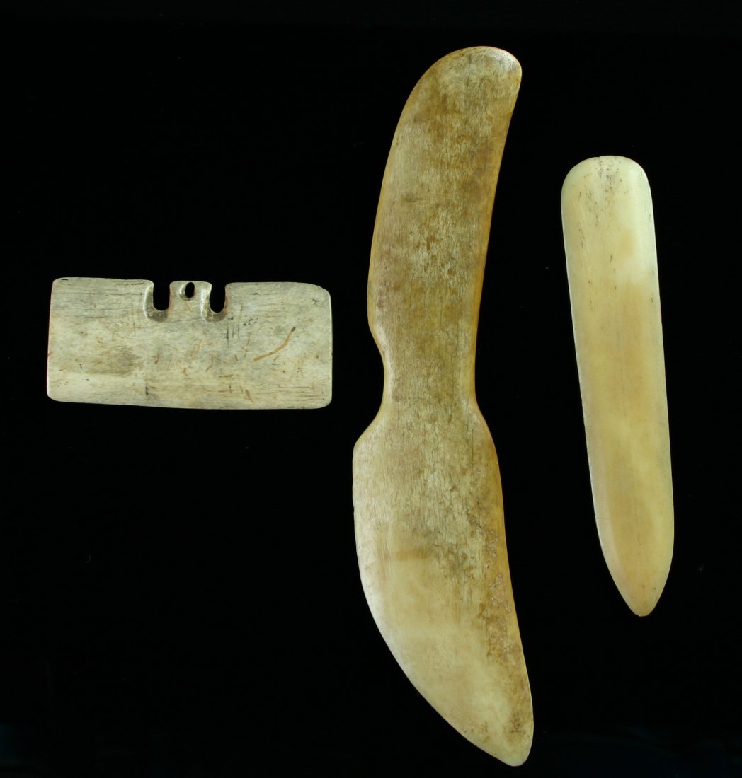 Set of Eskimo Bone Tools: Nice assortment of Eskimo/Inuit artifacts including a Snow Knife, a plate of Bone Armor, and a Net Gauge.