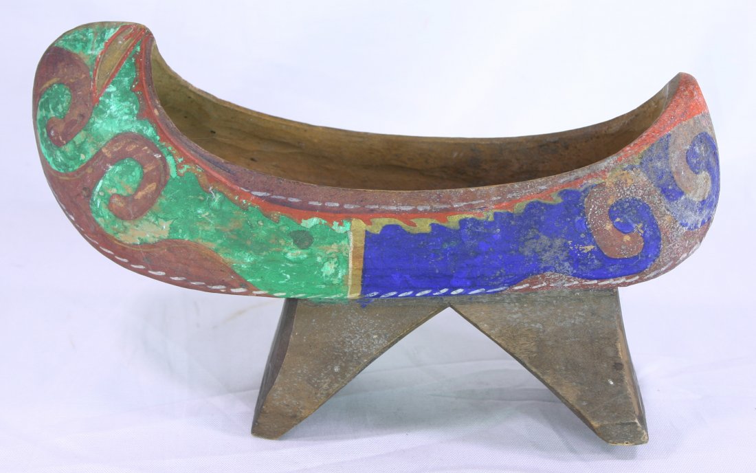 9 1/4" NW Coast Canoe Carving: Interesting carving of a canoe on stand hand carved from one piece. Colorful paint with a very 'folk' feel.