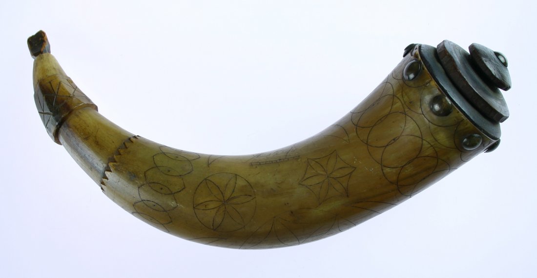 8 3/4" Powderhorn: Early 1800's example from New Hampshire with geometric designs reminiscent of the Pennsylvania Dutch. Engraved 'A.S. Haynes' and 'Western'. Wooden stopper and plug with brass tacks. Nice!