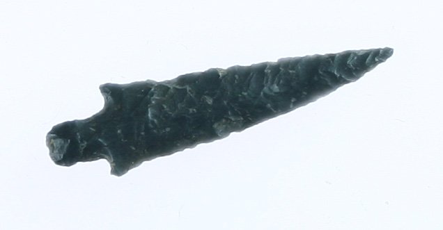 1 3/8" Dagger - Jackson G-10 COA: Smokey gray/black high grade chert with nice translucency. Ultra thin and extremely long with a needle tip. Yakima Co., Washington. Ex- Floyd Hammond and Bill Jackson Collection.s Jackson G-10 COA.