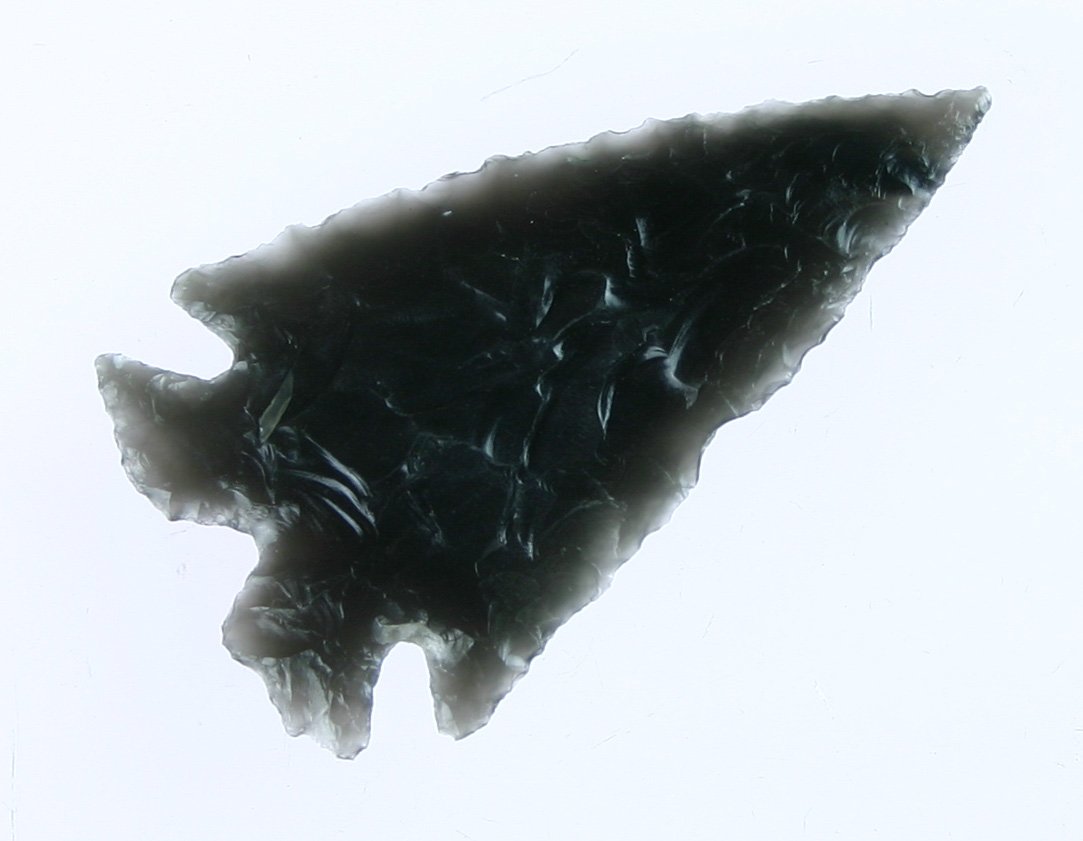 2 1/8" Obsidian Split Stem Elko - Ex Reuther Colle: Exceptional example. Highly translucent beautifully flaked Obsidian. Ex- William Reuther and Toni Hardy of BC Artifacts.