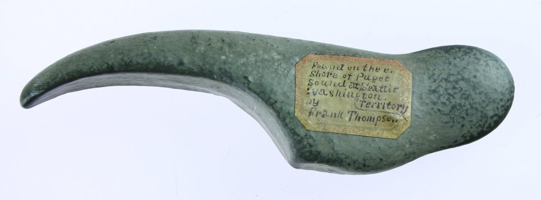 4 5/8" Bear-Claw Effigy: Carved from a gray-brown stone, this effigy claw was found on the Eastern Shore of Puget Sound at Seattle, Washington (territory) by Frank Thompson. Early label indicates 'Washington territory' sugges