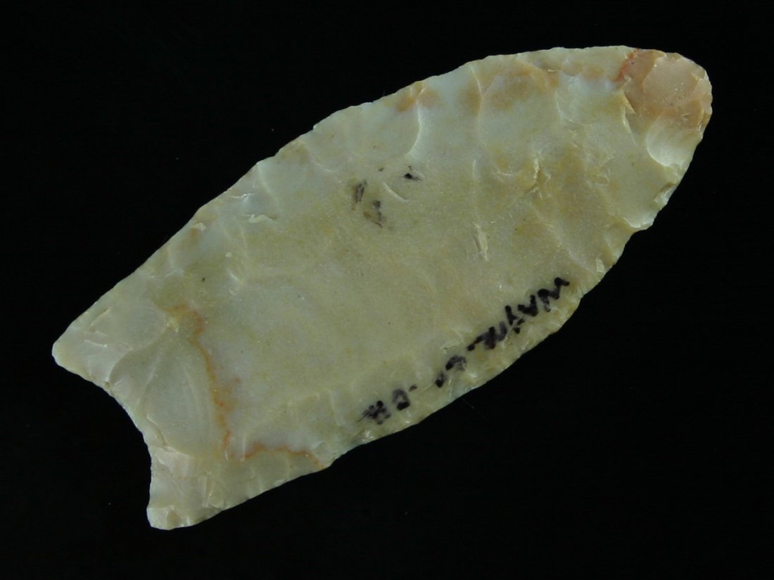 2 5/8" Clovis - Jackson G-9 COA: Wayne Co., Ohio example in Carter Cave flint. Translucent caramels with red streaks. Jackson G-9 COA.