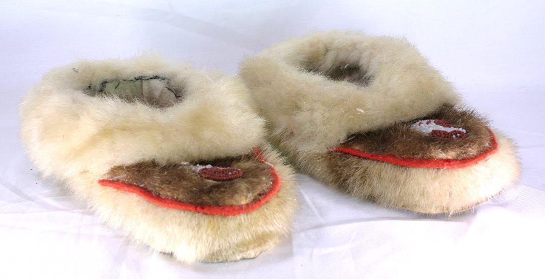 9 1/2" Pair of Fur Lined Beaded Moccasins: Alaskan type example with fur lining in good shape with beaded fronts. Use wear. Early 1900's. Ex - Theodore Kouba Collection.