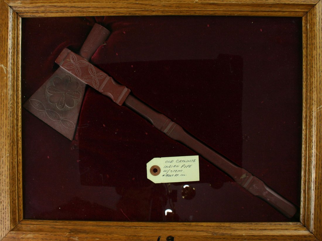 16" Engraved Catlinite Pipe-Axe with Stem: Very nice example with detailed engraving and attached stem formerly of the Theodore Kouba collection. Plains Type.