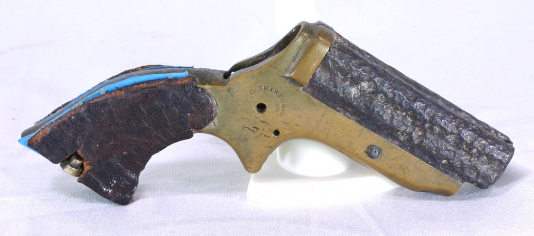 5" Sharps 4-Shot Pepperbox Derringer (2C) Pistol R: RELIC GRADE ONLY. Found in Wisconsin on the Kouba Farm and formerly of the Theodore Kouba Collection. Missing trigger parts and barrelgroup has significant pitting. Relic only, non-firing .30 rimfire.
