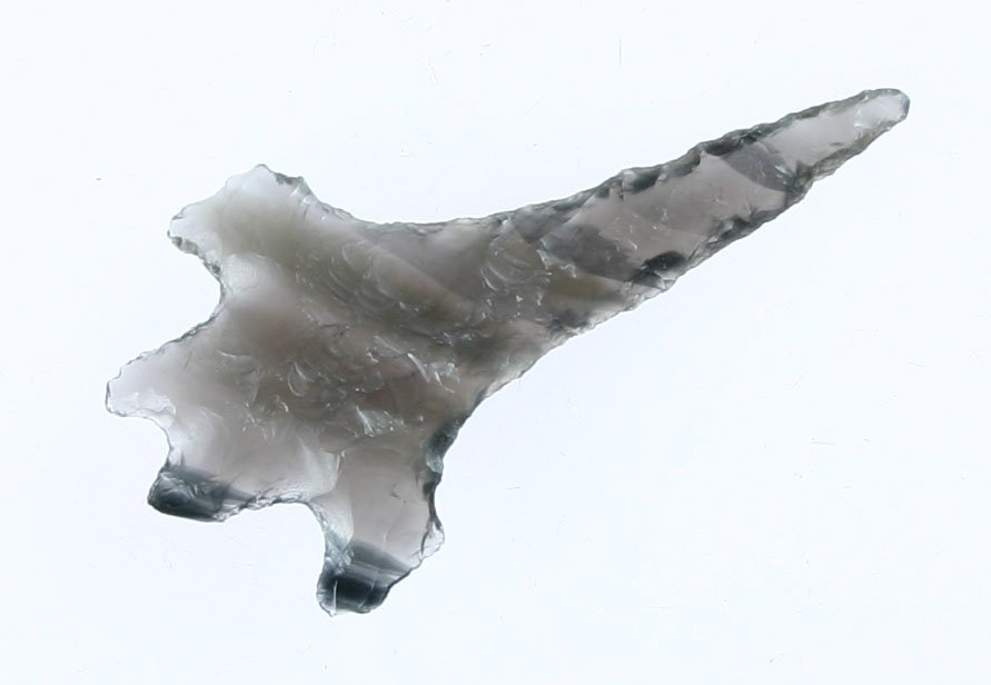 2 1/16" Elko Split Stem Drill: Superb example in totally translucent clear obsidian with smoky clouds. Northern California rarity.