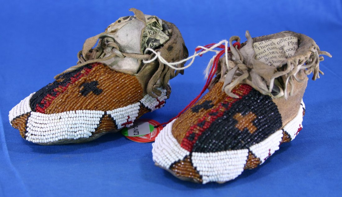 4 1/8" Pair of Beaded Baby Moccasins: Leather with fringe and 4 colors of beads on this set from the Northern plains. Tag says 'Crow'. Circa 1880-1900 AD