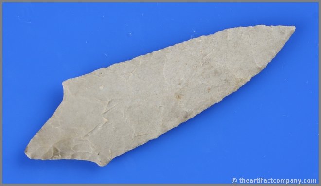 4 15/16" Stemmed Table Rock: Excellent example in a tan fossil chert from Oklahoma. Nice mineralization. Nice extended needle tip. Ex - Suter Collection.