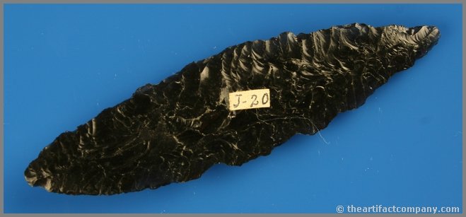 5 9/16" Cordilleran Knife: Awesome flaking. Highly translucent diagonally streaked 'Ice' Obsidian. Found by Reg Seely and The Beaushane Family between 1940-1971 in Lake Co., Oregon. Ex- Lange Collection. Somebody glued a white