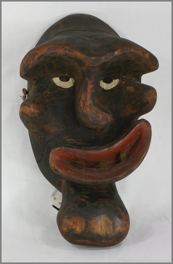 12 1/2" x 7" Iroquois False Face Mask: Wooden carved grotesque with tag that reads 'Collected in Oshwego, July 1952" Painted Wood with horn inset teeth.