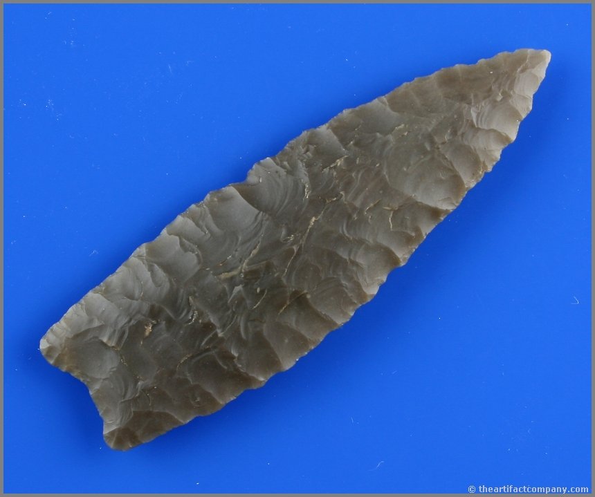 4" Plainview - Ex- Jack Litchfield: Truly outstanding artifact. Highly translucent root beer color laced with cream swirls Edwards Plateau Chert. Great form, flaking, and thinness. Ex- Jack Litchfield Collection. Texas type.