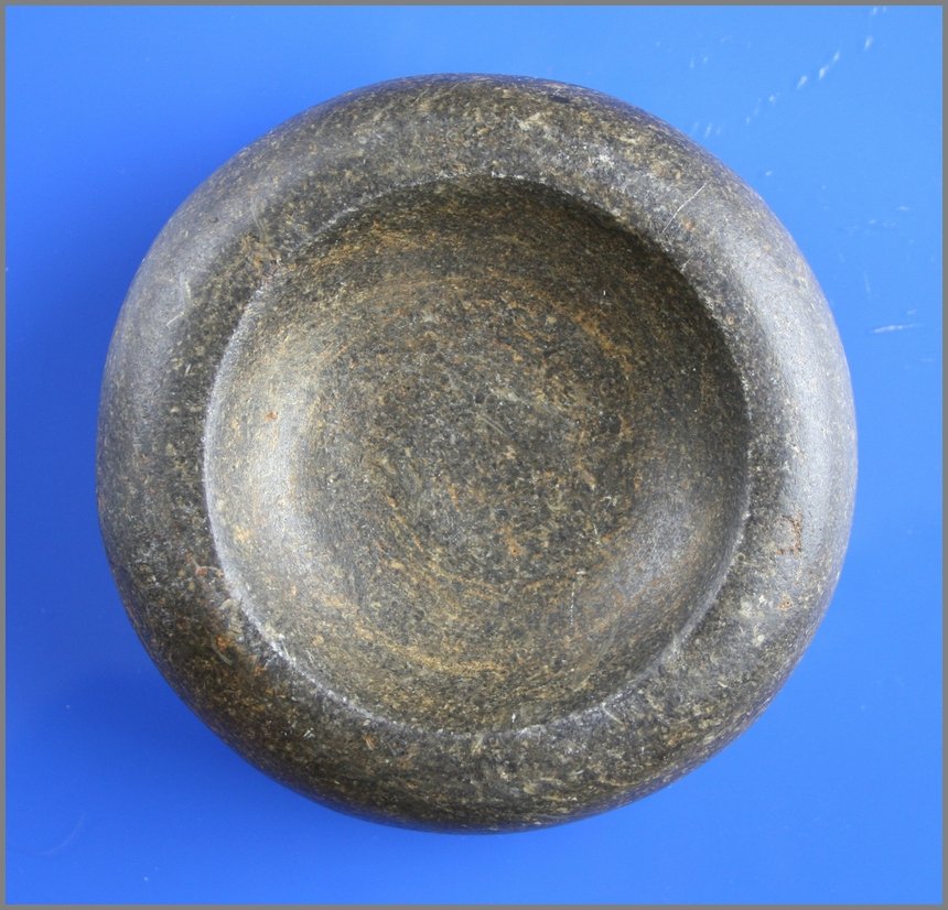 4 3/8" Cupped Discoidal Partain COA: Greene Co., Illinois example in a dark colored hardstone. Ex - Duane 'Beanie' Johnson and Charlie 'Modoc' Smith Collections. Partain COA.