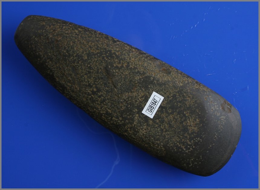 8" Slate Celt: Nice example made from banded slate and from Delaware Co., Ohio. Nice polish and peck marks. Rare in this material.