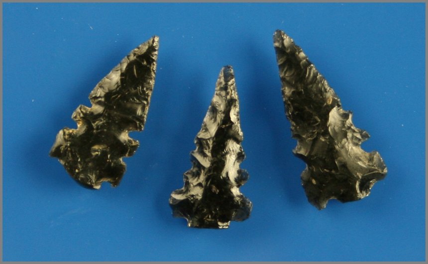 3 Obsidian Stockton Points: Extremely rare form. Glossy black obsidian. All multi-notched. Biggest is 1 1/8" Ex- Dennis Hammer Collection. Found between Galt and Modesto, California.