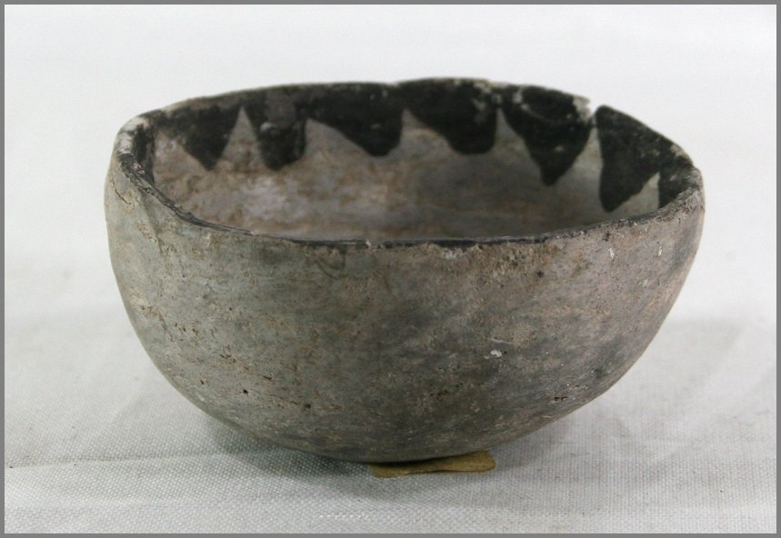 2 13/16" x 1 3/8" Anazasi Child's Bowl - Jackson COA: Mesa Verde type reported from Colorado. Extremely, extremely rare. The only 'Child's Bowl' we have ever handled. Solid and completey intact. Classic gray with intricate black paint. Ex- Manuel Collect