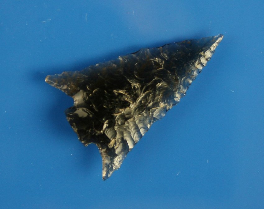 1 3/4" Snapped Base Elko Corner Notched: beautiful Ice Obsidian. Exquisite flaking. Perfect symmetry. Wafer thin. Truly a gorgeous relic. Oregon.