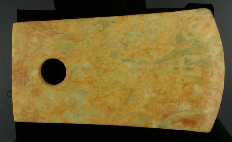10 1/4" Chinese Battle Axe: Drilled example of unknown age. Jade example with greens and yellows. Nice decorator. BIG!