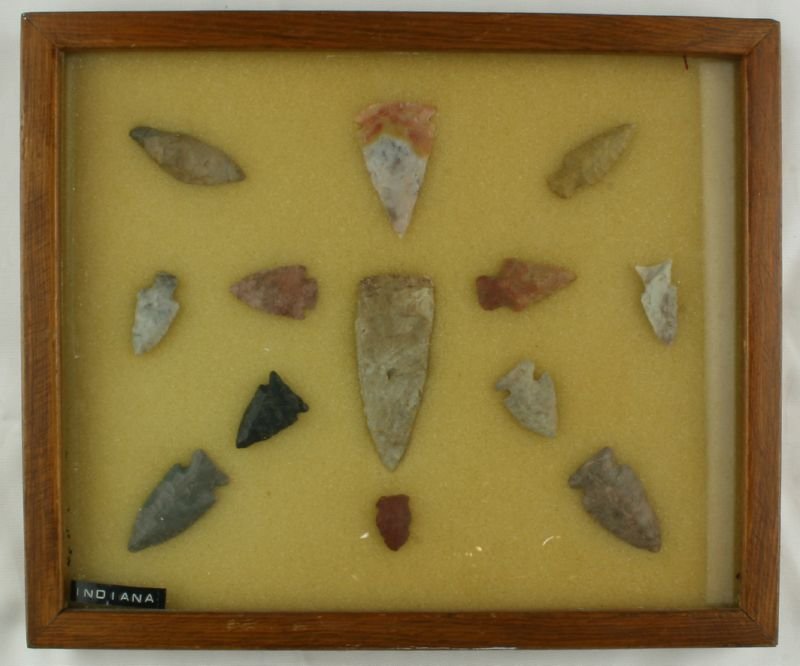 Frame of 13 Nice Arrowheads: Labeled Indiana. Nice old wooden and glass frame included. Ex- Ted Kouba Collection. Sold as Decorative.