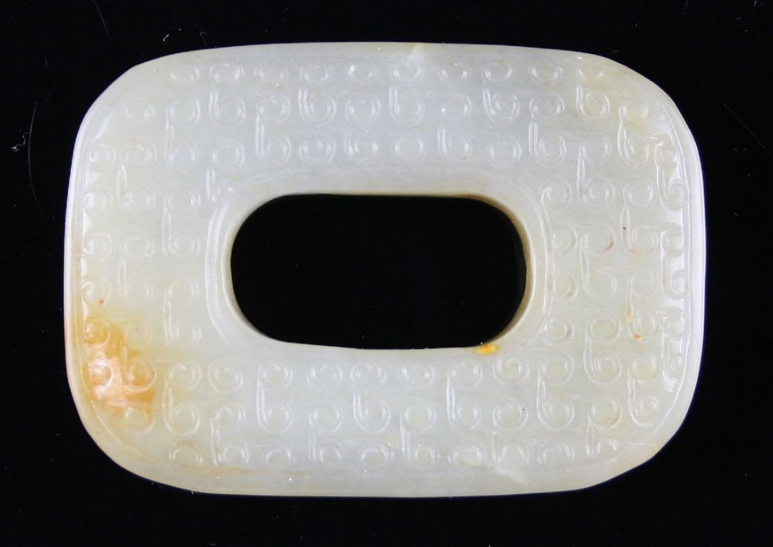 Beautiful 2 5/8" Chinese Jade Belt Ornament: Intricately carved in Scrolling Clouds motif. Beautiful translucent Jade. Later recreation of Han Dynasty style belt ornament. Weighs 50 grams.