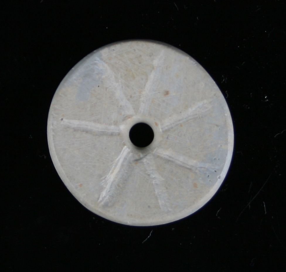 1 1/4" Ft. Ancient Discoidal: Drilled and engraved example out of Pipestone from Ohio.
