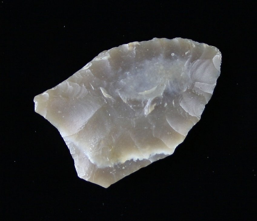 1 3/16" Folsom: Nice totally translucent high grade flint piece. Lightly fluted. Found on Smith Point East side near Dam B. in Texas 1951 Ex - Russell Long Collection T152/123