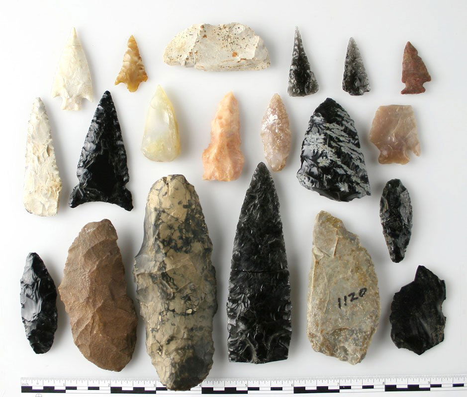 Collection of 20 Northwestern Arrowheads: Obsidians, Agates, and Jaspers knives and arrowheads. Largest is an intact 4 1/2" Obsidian Knife loaded with alkali salts.