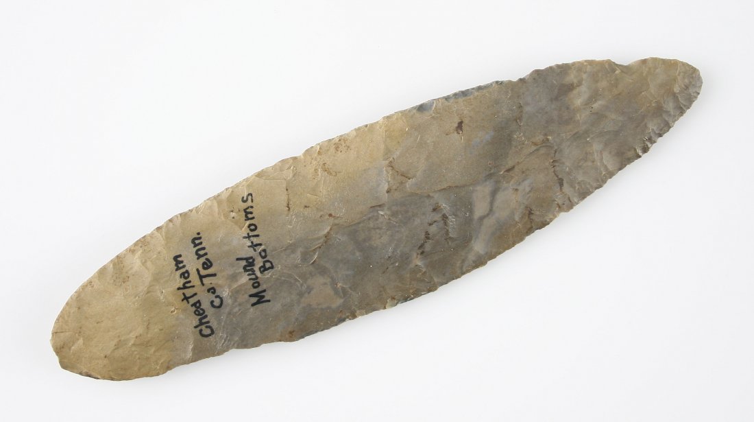 7 1/8" Adena Knife: Excellent large knife from the Cheatham Co., Tennessee Mound Bottoms. Fort Payne chert example with slight agricultural shear damage.